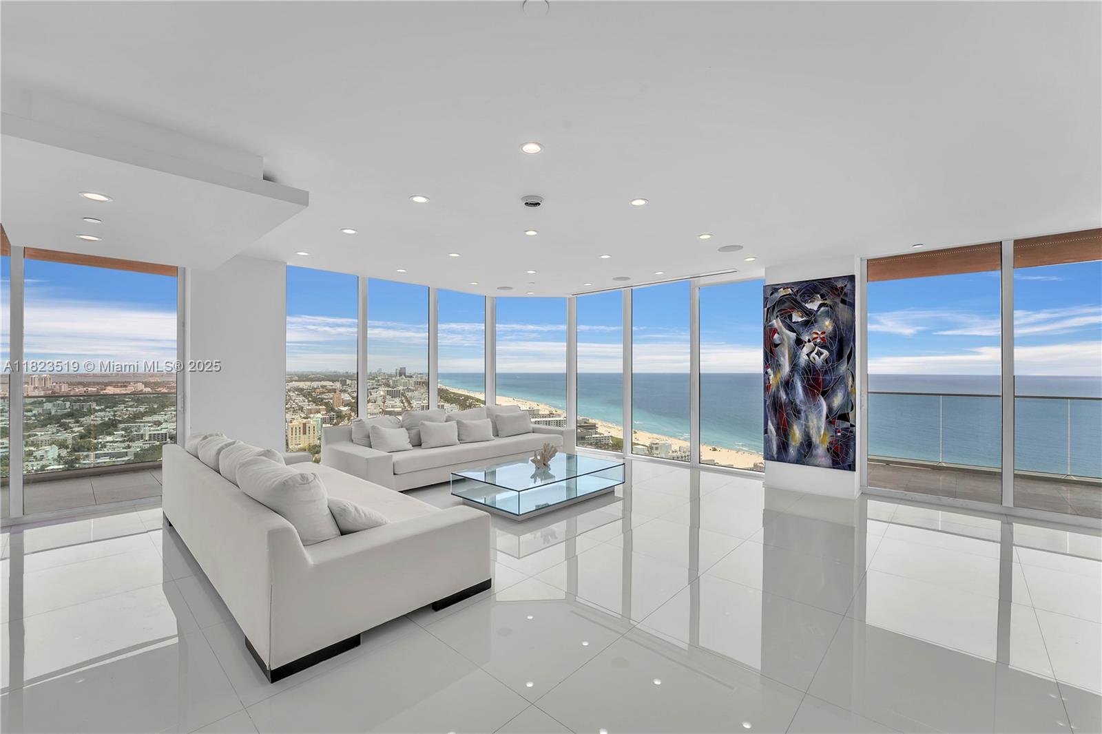 South Beach Sky Mansion
Commanding the entire wing of the 34th floor this exquisite 4,723 SF residence offers privacy, scale, and panoramic views rarely found outside penthouses. With 270° floor to ceiling glass framing sweeping vistas of the Ocean, Bay, the Miami skyline and Park.
Step from private elevators into artful interiors. The open-concept living areas flow seamlessly to a sleek, modern Bulthaup kitchen with a waterfall-edge stone island and premium appliances for entertaining or serenity.
This unique 4/3.5 residence boasts 4 infinity balconies, 2 oversized primary suites, and designer details. Enjoy total peace, no shared walls & enhanced security within Portofino’s newly completed $60 million renovation—featuring a soaring lobby, resort amenities.