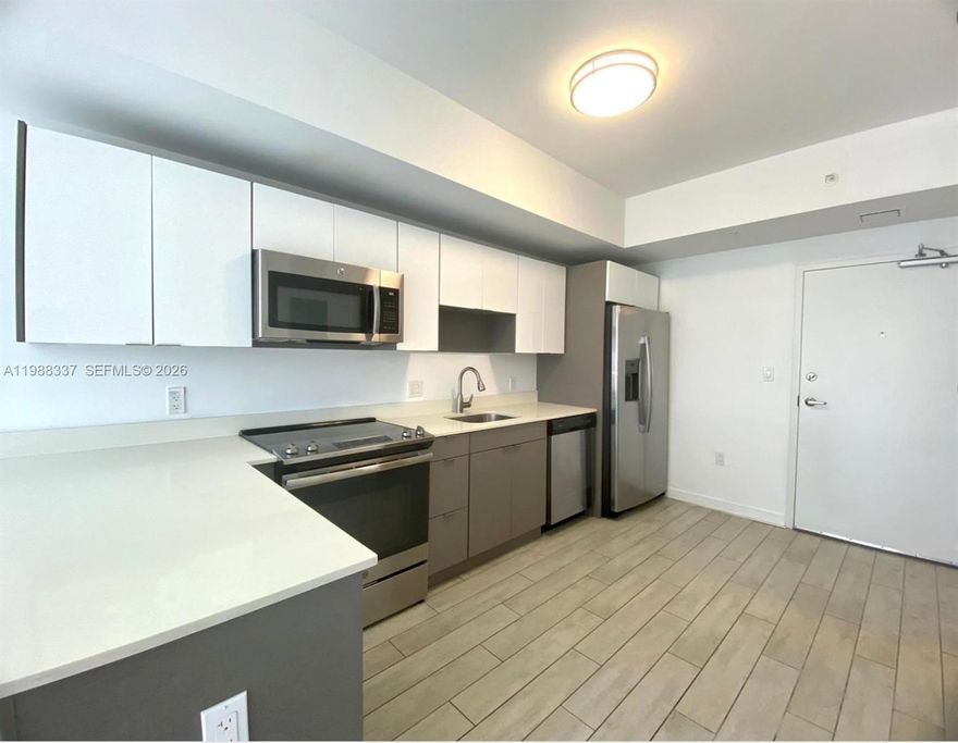 Bright and modern residence in the desirable 26 Edgewater boutique building, located in the heart of Edgewater. This well-designed unit features an open-concept layout with porcelain tile flooring throughout, a sleek contemporary kitchen with quartz countertops, stainless steel appliances, and ample cabinet space.
Enjoy abundant natural light and a private balcony with city views, perfect for relaxing or entertaining. The unit also includes an in-unit washer and dryer for added convenience.
26 Edgewater offers excellent amenities including a rooftop pool with stunning skyline views, fitness center, social lounge, and secure entry. Ideally located just minutes from Midtown, Design District, Wynwood, and Brickell, with easy access to dining, shopping, and major highways.