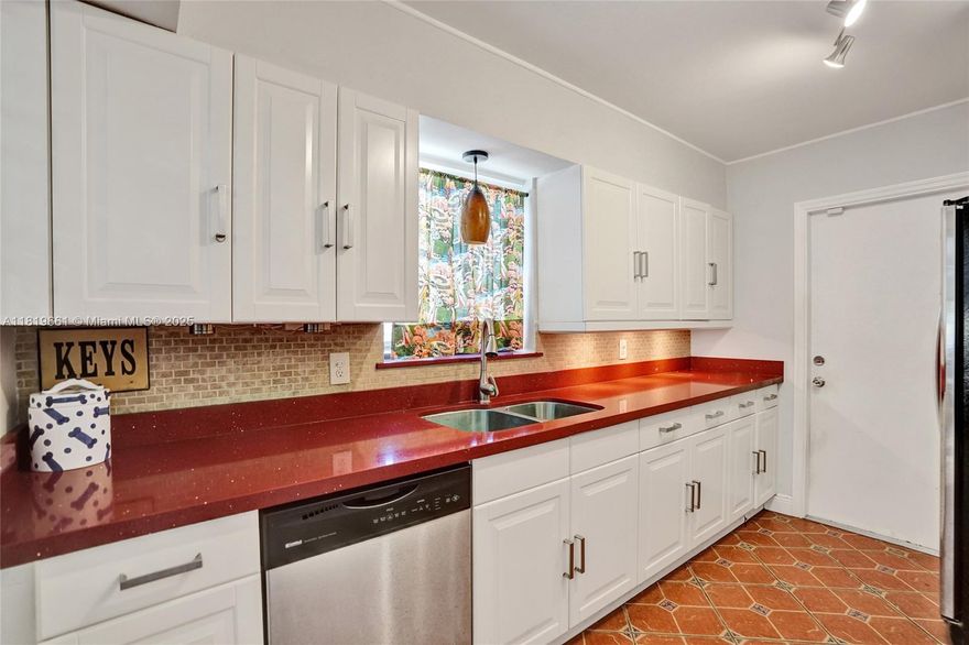 Located 5 minutes to Hollywood Beach. Beautiful updated 2 BR 2 BA, 1 Car garage + a den & office could be used as a 3rd B/R home located on a quiet tree lined street, 2019 Tile Roof. Hurricane Impact Windows. NO HOA. Fully fenced in Private backyard 6' high vinyl fence with doublewide electric remote doors, perfect to park RV/Boat. Room for a Pool. New Tankless Water Heater. Kitchen features newer appliances, Quartz counter tops. Tile & laminate wood flooring, ceiling fans. Huge backyard, wood pergola, screened sunroom. Garage entrance with plenty of room in alley to pull in truck, RV, boat. Great location, only minutes away from both Downtown Hollywood & the beach. Minutes to Ft Lauderdale & Miami. High elevation No flood insurance required