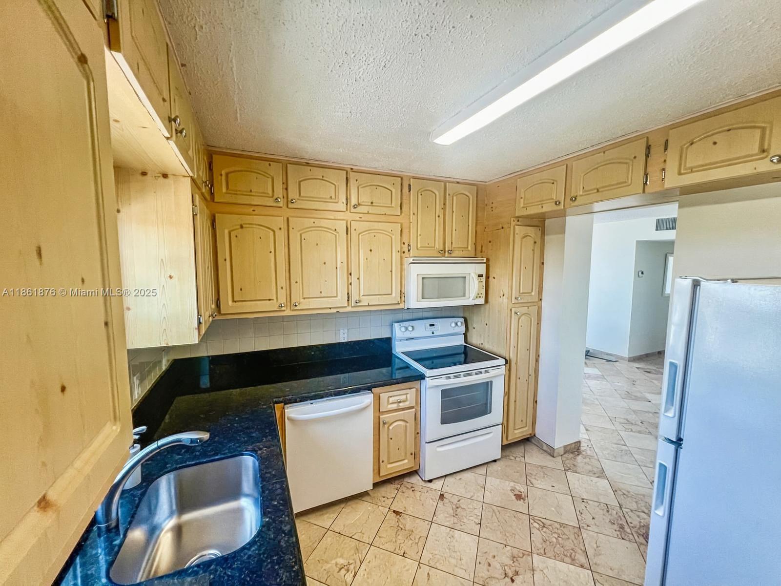 Updated 2-bedroom + den, 2-bathroom condo features marble tile throughout and a modern kitchen with granite countertops, ample cabinetry, a pantry, and abundant natural light. Enjoy a larger balcony, overlooking the tranquil canal.
Located just minutes from I-95, the Palmetto Expressway, the Turnpike, Aventura Mall, the beach, and Oleta River State Park, this residence offers convenience and space. The secure building includes a gated parking area and lobby intercom system for added peace of mind.
Showings by appointment only.