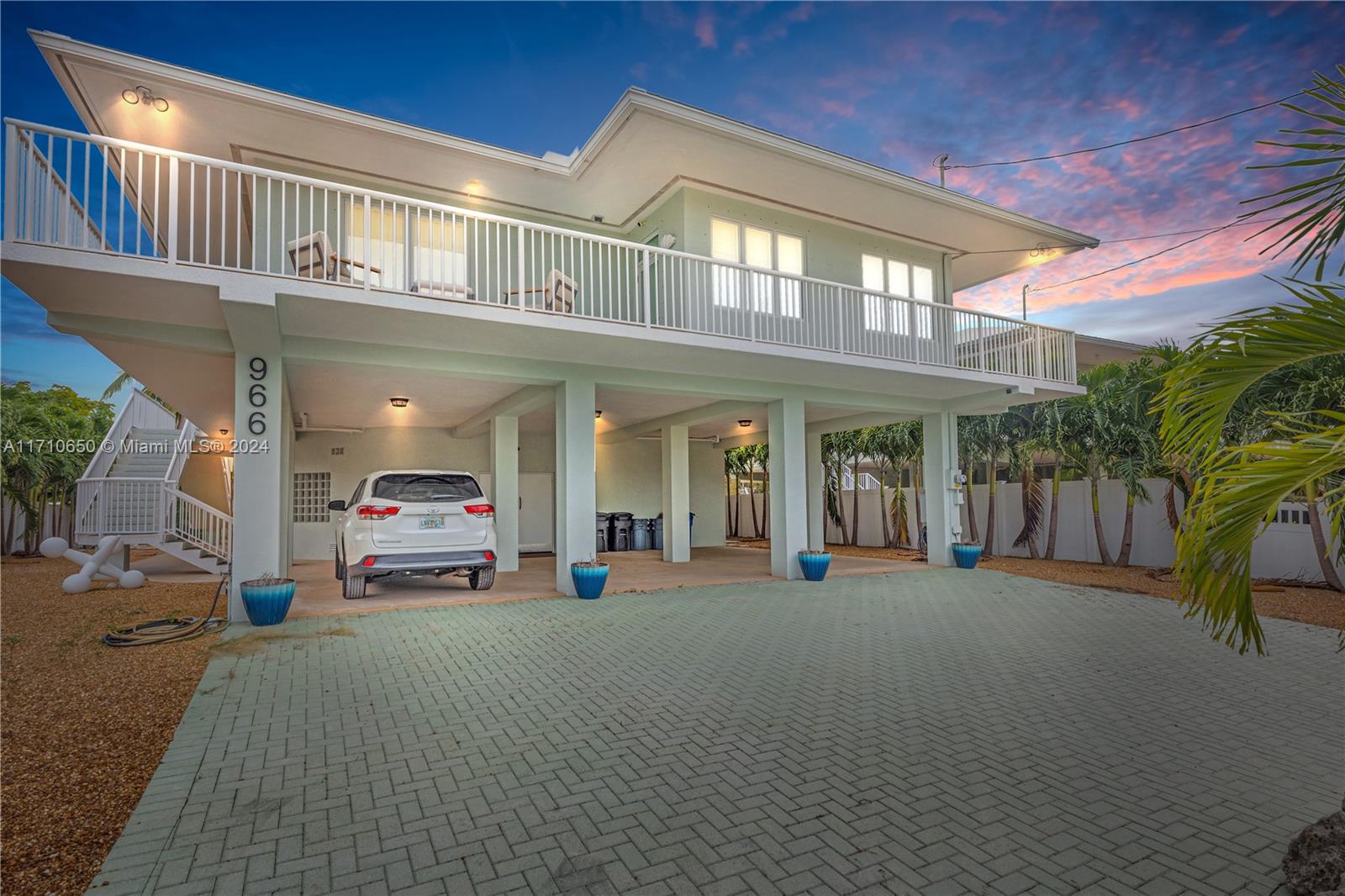 This stunning 3-bedroom, 2-bath home features a brand-new metal roof, a newly added pool, and a pergola with an outdoor kitchen, ideal for entertaining. Polished floors flow throughout, leading to a modern kitchen with stainless steel appliances. Enjoy breathtaking sunsets from the front deck and tranquil canal views from the rear deck. The property boasts a 70’ concrete dock with a 20,000lb boat lift, kayak storage, and dock bumpers. Outdoor highlights include lush landscaping, privacy fencing with remote-controlled gates, and a 220V 50-amp RV hookup. Built with solid CBS construction, the home offers hurricane-rated features and a 1,000 SF enclosed workshop/garage. Minutes from the Atlantic Ocean, this home blends luxury and convenience with easy access to Miami.