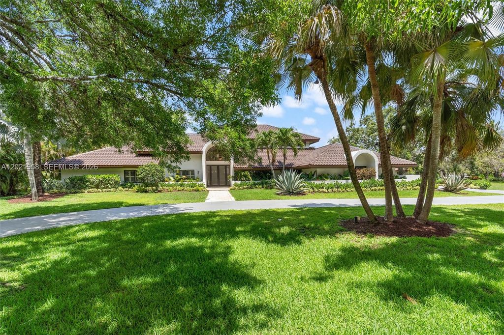 Photo of 7011 Hialeah Ln, Parkland, FL 33067 (MLS # A12021958)