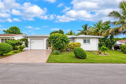 Photo of 6100 NW 73rd Ave, Tamarac, FL 33321 (MLS # A12104636)