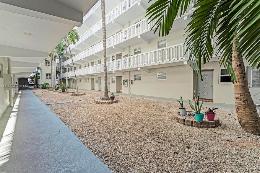 Charming ground-floor 1-bedroom, 1.5-bathroom condo in a prime Hallandale Beach location, right across from Gulfstream Park. This well-maintained unit features completely tiled floors, a spacious eat-in kitchen, and an enclosed patio with new hurricane windows—perfect for use as a separate room or office. The oversized master bedroom boasts ample closet space, while the recently replaced A/C unit and water heater provide added peace of mind. Situated in a 55+ community, this condo is just minutes from Aventura Mall, a short 5-minute drive to the beach, restaurants, and shopping, and offers easy access to Fort Lauderdale Airport. An unbeatable location at a fantastic price! **SE HABLA ESPAÑOL.**