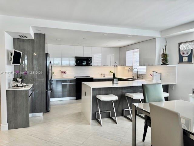 WOW! NEW NEW NEW! ENTER THIS COMPLETELY RENOVATED MODERN RESIDENCE IN THE HEART OF BAY HARBOR ISLAND & IMMEDIATELY & THROUGHOUT SEE THE BEST DIRECT WATER VIEWS OF THE INDIAN CREEK LAKE & ISLAND. THIS COVETED 2 BEDROOM/2 BATHROOM SPLIT PLAN HAS A NEW OPEN STATE OF THE ART GOURMET KITCHEN & ALL NEW BATHROOMS. THE FINEST FINISHES INCLUDE ALL NEW TILE FLOORS THROUGHOUT, ALL IMPACT GLASS WINDOWS, CUSTOM LIGHTING & MORE! A PERFECT 10! HEATED POOL. THIS BOUTIQUE WATERFRONT BUILDING HAS ALREADY PASSED 50 YEAR RECERTIFICATION, MAJOR UPGRADES, INCLUDING A NEW SEA WALL, NEW BALCONIES, & FULL CONCRETE RESTORATION.
MONTHLY $1,357 + $357 TEMPORARILY FOR RESERVES.