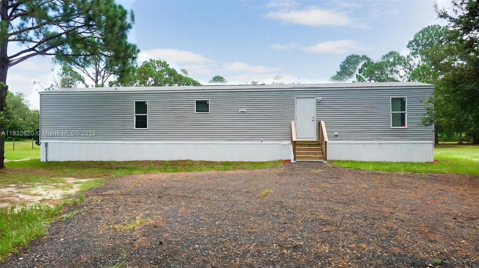 Charming 3 Bed / 2 Bath Mobile Home on 1.25 Acres – Clewiston, FL
Discover peaceful country living in this well-maintained 1,000 sq ft mobile home, built in 2022 and nestled on a spacious 1.25-acre lot in Clewiston, FL. The home features 3 bedrooms, 2 bathrooms, a brand-new septic tank, and a 150-foot-deep well with a new filtration system.
Additional upgrades include a fully fenced property and newly installed underground electric. Whether you’re looking for a quiet getaway or a full-time residence, this property blends comfort, functionality, and space to grow.