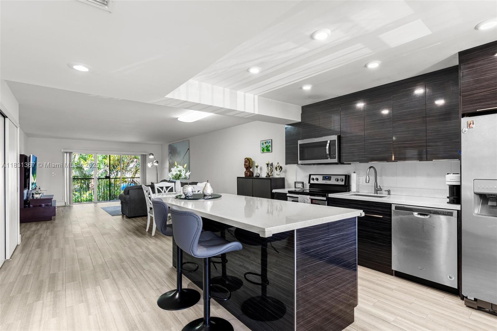 Escape the summer heat and retreat into this fully remodeled condo located in one of South Florida's most desired cities to live in! Ideally located in the heart of Weston, this Gardens at Bonaventure condo was was completely updated only a few years ago and meticulously cared for since. With a recently passed 40 year recert, a completely new roof replaced in 2024 (all assessments have been fully paid), and all windows protected by hurricane rated shutters; your future investment will keep you and your loved ones safe and protected for many years to come. And whether you want to stay active at the many parks and sports activity options surrounding you or sit down and relax at the plethora of dining options Weston offers, it's time to realize that your perfect condo has finally arrived!