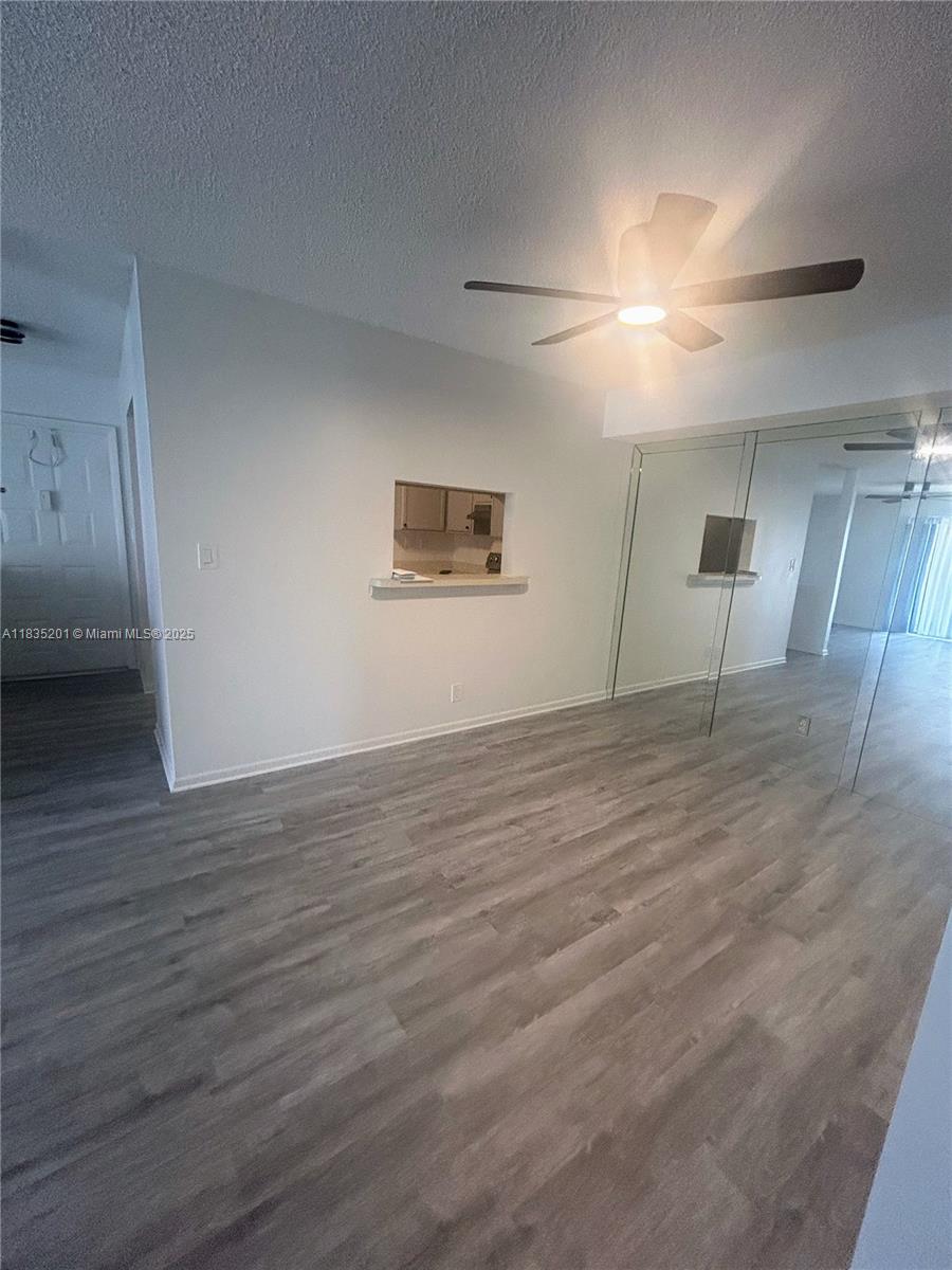This renovated 2 -2 unit boasts a spacious 1019 sq ft of living space plus a balcony. The modern kitchen features stainless steel appliances and seamlessly flows into the bright, open concept living area, equipped with a remote control ceiling fan in every room and living area. Enjoy the convenience of an in-unit washer and dryer, along with generous closet space, including a walk-in closet with built-in shelving. Residents can take advantage of fantastic shared amenities such as a fitness center, community pool. A convenient location with Turnpike and US-441 2 min away. Shopping, restaurants, hospitals close by, all kinds of outdoor enjoyment at your doorstep. Don't miss out on this opportunity—schedule a viewing today and make this inviting condo your new home!
