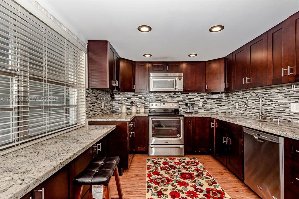 Photo of 625 Oaks Dr #503, Pompano Beach, FL 33069 (MLS # A11931269)