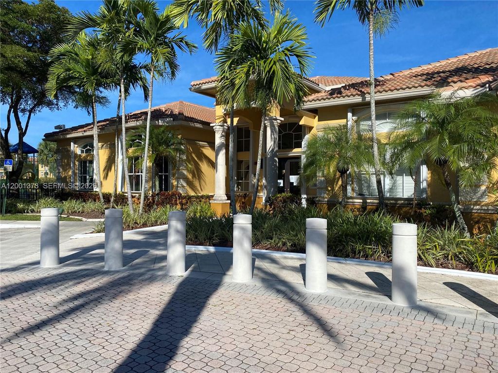 Photo of 9645 nw 1st Ct #1-302, Pembroke Pines, FL 33024 (MLS # A12001373)