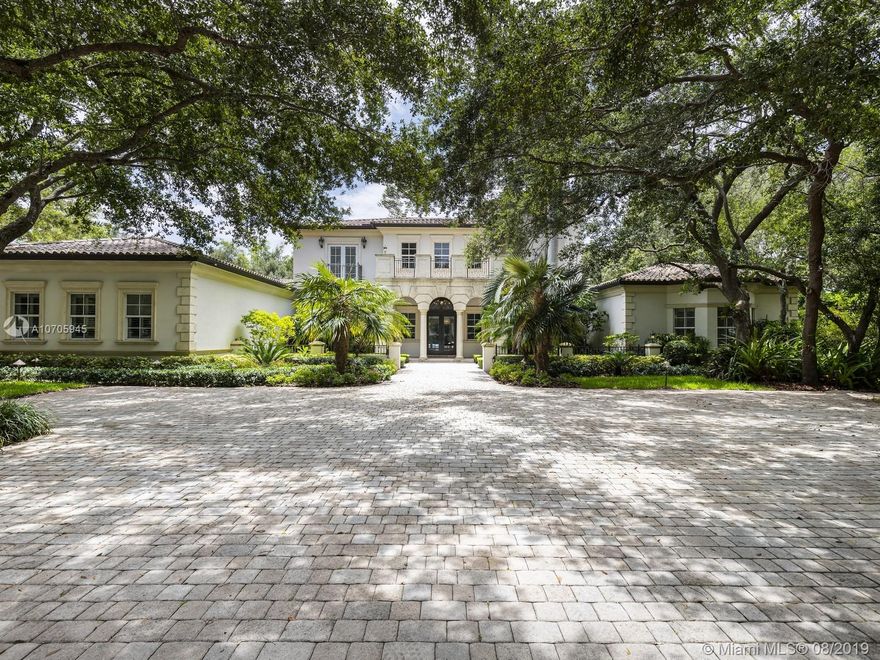 Fill your desire of residing in the ultimate retreat. Located in sought after North Pinecrest, this custom-built estate is a synthesis of sophistication and contemporary aesthetics sitting on a 1.15 acre-lot. Welcomed by expansive gate entry surrounded by mature oak trees and illuminated landscaping, find pleasure in exploring the property’s ample exterior entertaining space with modern home integration, resort style pool, and summer kit. Grounding the home is a spacious master bedrm and bath with surplus bedrms on second flr. An inviting residence, the bright design is fixed with high ceilings, formal living, dining rm, library, den, and family room adjacent to gourmet kit. Additional features include wine cellar and 3 car garage.