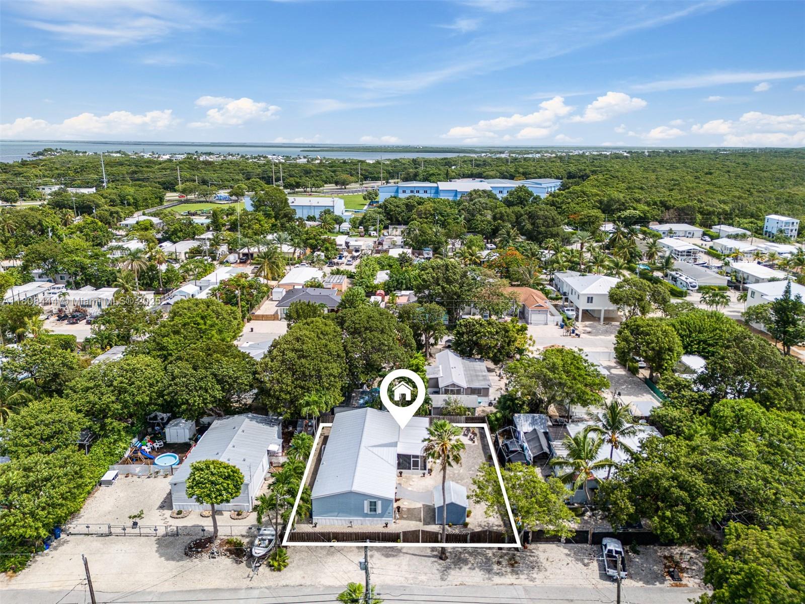 Own this 4 bedroom/2 bathroom home and live like you're always on vacation in Key Largo. Located on the desirable oceanside. This property has everything you've been searching for. With many features and upgrades and plenty of space for family and friends, this home boasts an impressive 1,800-square-foot floor plan on a generous 6,000-square-foot lot. There is plenty of room for a boat, RV, or pool. Are you a boater? This property offers a private boat ramp one block away from the property. Schedule a showing today, and don't miss out!