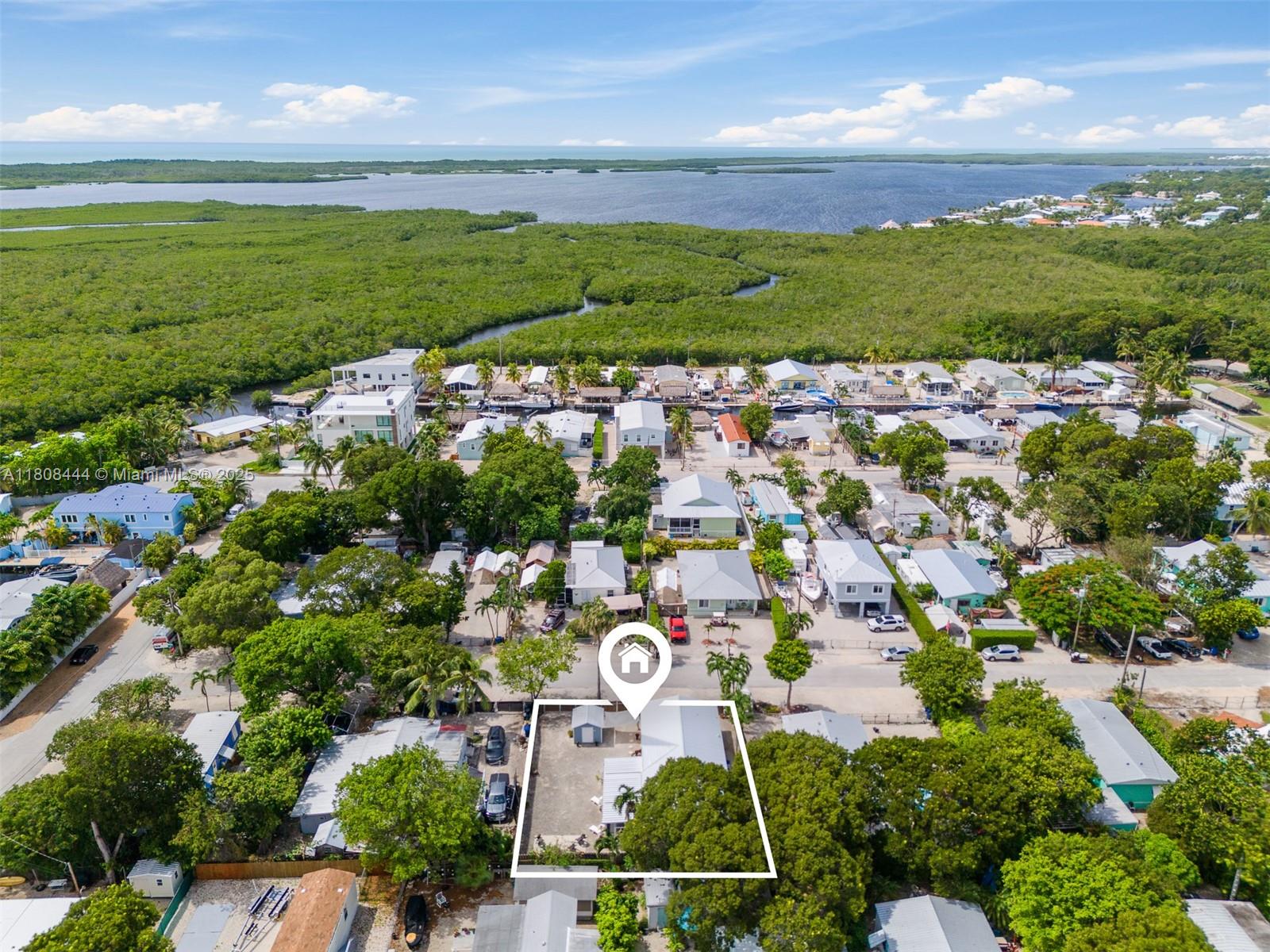 Own this 4 bedroom/2 bathroom home and live like you're always on vacation in Key Largo. Located on the desirable oceanside. This property has everything you've been searching for. With many features and upgrades and plenty of space for family and friends, this home boasts an impressive 1,800-square-foot floor plan on a generous 6,000-square-foot lot. There is plenty of room for a boat, RV, or pool. Plus, there's no need to worry about storage space, as a large shed is included in the sale. Are you a boater? This property offers a private boat ramp one block away from the property.