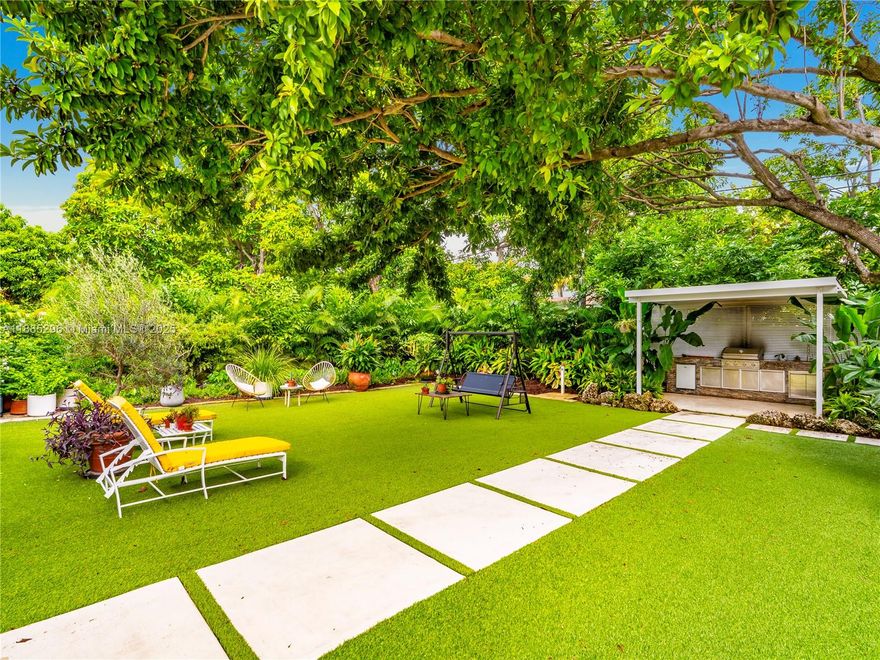 Rarely available, this beautifully renovated single-family gem in North Miami Beach offers the ultimate in South Florida living. Step outside to your private backyard oasis, surrounded by lush tropical landscaping, mature trees, and sculptural succulents. Enjoy a spacious covered lounge and a separate grill area designed for entertaining and relaxation. Inside, the home boasts a stunning chef’s kitchen with premium finishes, modern appliances, and a convenient pass-through window to the patio. The sunlit primary suite provides direct access to the yard, creating a seamless connection between the home and its resort-style grounds. Additional features include a versatile storage room and a rare covered side alley—perfect for a boat/RV. Home is also available furnished.
