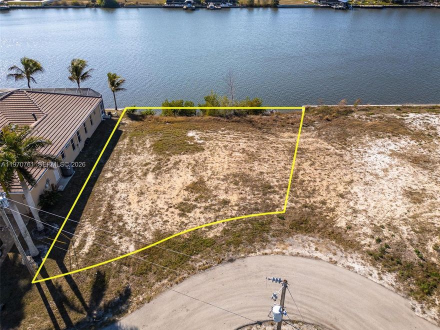 This direct Gulf access waterfront lot in Northwest Cape Coral offers 112 feet of canal frontage on a wide, direct-access canal with no bridges to the Gulf of America via the Matlacha Pass. Located on a quiet cul-de-sac in a neighborhood just off Old Burnt Store Rd, this buildable canal-front lot is the perfect opportunity to design and construct your dream home in one of Cape Coral’s fastest-growing boating communities. Boaters will appreciate the wide canal that can accommodate a variety of vessel sizes and allows for a custom dock and lift tailored to your needs. Enjoy boating to waterfront dining at Miceli’s or Yucatan Waterfront Tiki, fishing the mangroves of Matlacha Pass or cruising to open water while spotting the ever-present dolphins and manatees along the way. This waterfront lot is also positioned nearby the future Seven Islands development, officially approved by the Cape Coral City Council and projected to include a marina, hotel, amphitheater, dog park & more - making this not just a lifestyle purchase, but a strategic investment opportunity in Northwest Cape Coral. Less than three miles away, newly completed Crystal Lake Park offers walking trails, freshwater fishing, playgrounds, and green space, adding everyday convenience to your waterfront lifestyle. If you’ve been searching for a direct Gulf access lot on a wide canal in Cape Coral where you can build your custom dream home, this is your opportunity to create the ultimate Southwest Florida tropical oasis.