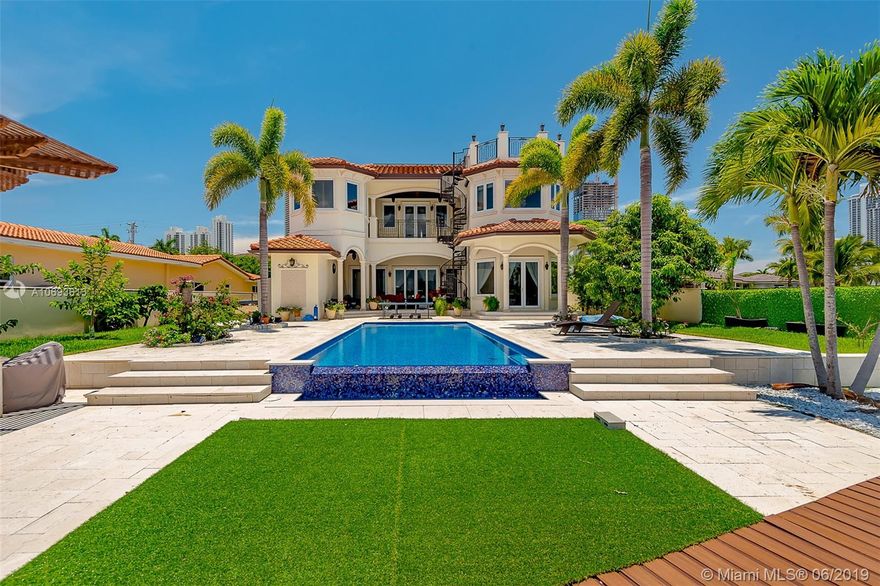 Luxury built in 2014 waterfront situated on the wide Bayfront in Sunny Isles. Impeccable artistry & water views.  Remarkably crafted home with modern & sophisticated interior. Inside, a dramatic foyer leads to the open-concept living areas featuring a chef’s kitchen, dining area, elegant living room with high ceiling and beautiful marble floors. Two balconies upstairs.  Master with 2 custom closest, lux bath with bath tub and steam shower. 4 Bedrooms, Office, Movie room, sauna as special features. Finishes include: marble & wood floors, high coffered ceilings, Italian doors, smart control system, sec. cameras.  Expansive backyard, heated pool, spa, covered patio, boat dock, beautiful verandas. SOLAR PANELS. Pay almost nothing for electricity.
Please click on VIRTUAL TOUR (3D Virtual Tour)