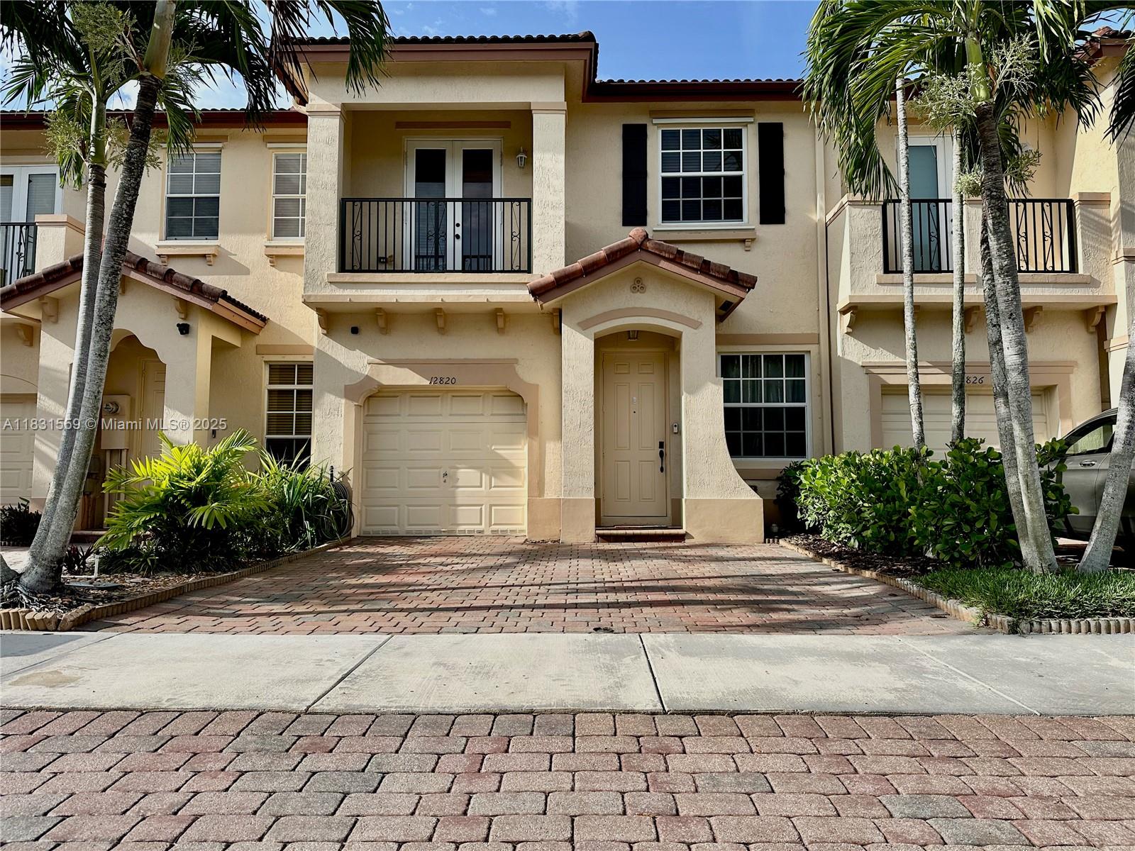 Remodeled 3BR/2.5BA move-in-ready home features a new kitchen with quartzite countertops & stainless appliances(2022), waterproof luxury laminate wood flooring (2022), ALL HURRICANE IMPACT WINDOWS & DOORS, updated bathrooms and LED flush mount lighting. The open floor plan and 9ft ceilings make this townhome feel spacious; unique only to this unit. The oversized primary suite offers dual sinks, tub and walk in shower as well as a large walk-in closet.
Enjoy a private Tuscan inspired yard with olive trees and garden beds. Resort-style amenities include 2 pools, clubhouse, playground, gym, and 24/7 security. Plenty of parking with 2 deeded spaces + garage. HOA covers common areas, basic cable. Great family filled neighborhood to raise a family.