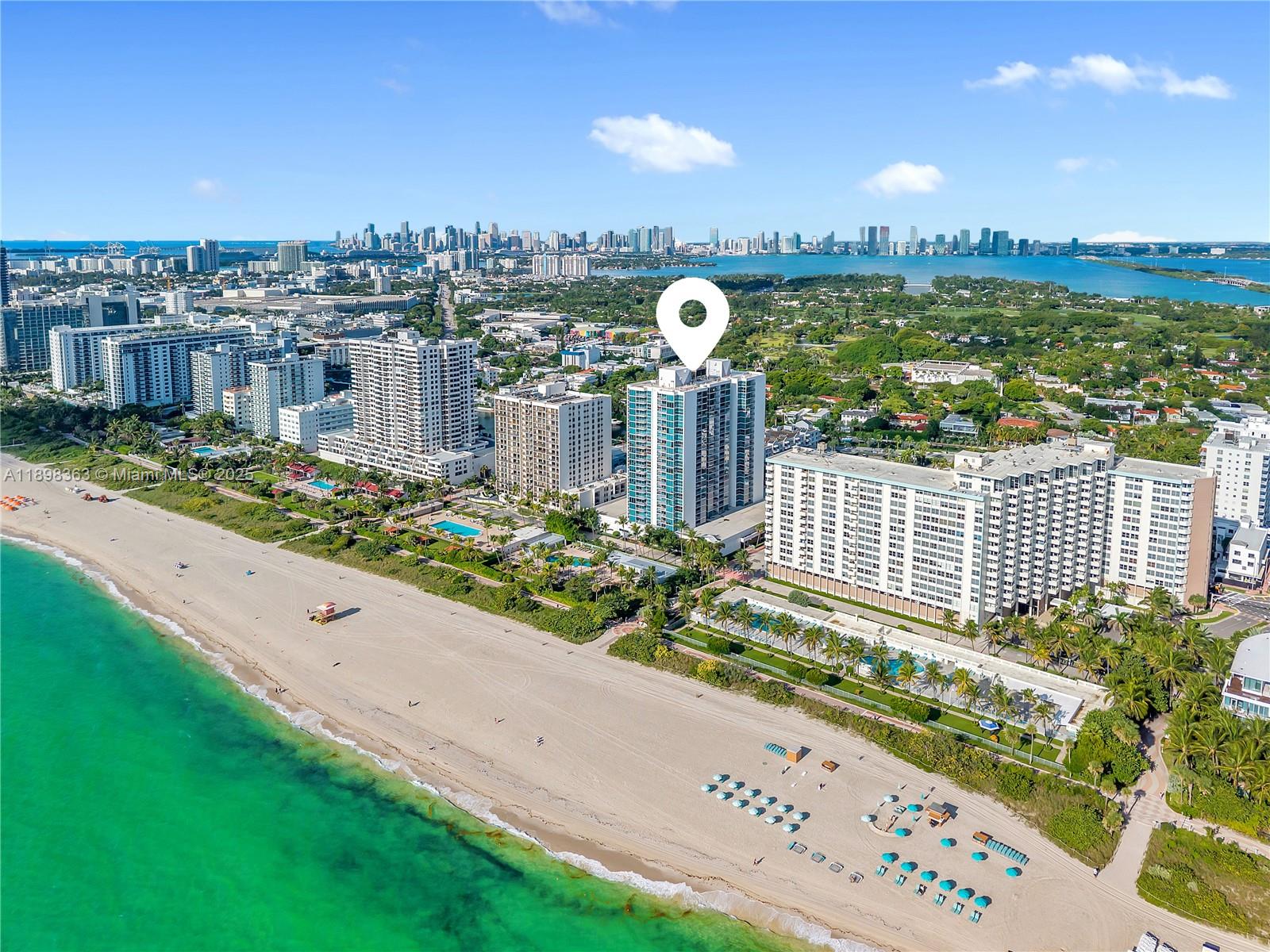 Corner 2 bed + den, 2 bath residence in an oceanfront building in Miami Beach. The floor plan offers exceptional privacy with a split-bedroom layout and a den with window and natural light—ideal as a home office or guest space. A bright living/dining area opens to a terrace showcasing the Miami skyline, Indian Creek waterway, and city lights by night. The kitchen sits at the center of the home and invites full renovation to unlock its potential. Tile floors throughout, generous closets, and a welcoming foyer add comfort and flexibility. Oceanfront pool, gym, 24-hour security. Minimum rental 90 days permitted—an excellent option for investors or end-users seeking flexibility.