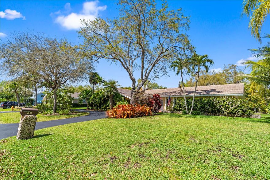 ABSOLUTE BEST PRICED 5 bedroom pool home in all of Palmetto Bay! This stunning 5-bedroom, 3.5-bath residence offers a blend of charm, comfort & functionality. A welcoming double-door entry opens to spacious formal living & dining areas highlighted by classic Saltillo tile floors & abundant natural light. Impact windows & doors for both peace of mind & energy efficiency. Inviting kitchen features rich wood cabinetry, granite countertops, stainless steel appliances, double oven & convenient eat-in snack bar. Designed for both everyday living & entertaining, the kitchen flows seamlessly into the family room, complemented by a butler’s pantry & wet bar. The generously sized primary suite showcases warm wood flooring, a large walk-in closet, & well-appointed ensuite bath with dual vanities, a glass-enclosed shower, & soaking tub. Four more large bedrooms & tastefully updated bathrooms provide ample space for family & visitors. Outdoor living is equally appealing with travertine patio & pool deck, covered terrace, & screened-in pool overlooking a fenced yard with lush tropical landscaping. Additional features include an indoor laundry room with sink & cabinetry, circular driveway, 2 car side-entry garage & brande septinc tank. Located on a quiet street just minutes from Bill Sadowski Park, Deering Estate, Palmetto Bay Branch Library, & some of the area's most highly regarded schools, this home offers the best of Palmetto Bay living at absolute the most attractive price. SEE IT NOW!