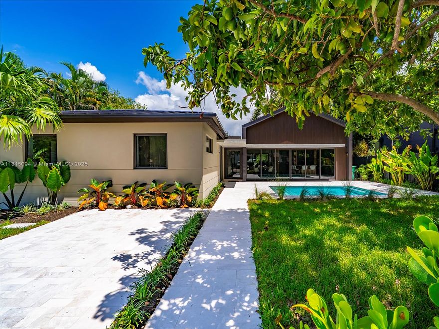 Welcome to 2777 Calusa St. where style, function, and location meet in perfect harmony. Set on a rare 7500 SF triple frontage lot in the heart of Coconut Grove, this 4-bed, 3.5-bath stunner has been completely reimagined from the ground up. Step into an open-concept living space flooded with natural light and anchored by a showpiece European-style kitchen with custom cabinetry and sleek integrated appliances all framed by massive sliding glass doors for that indoor-outdoor Grove vibe. Enjoy high-end touches, porcelain tile floors, full home office, spacious family room & laundry room. Outside, unwind by the stylish pool, host effortlessly with multiple carports & enjoy total privacy. This is not a rebuilt, this is a full reinvention, and it’s one of Coconut Grove’s coolest new offerings!