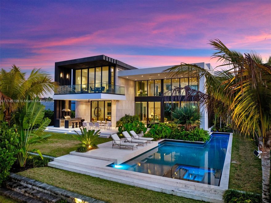 Your brand-new tropical modern home awaits in Golden Isles. Designed by SDH Studio Architecture + Design and built by TREO Construction, this nearly 7,000 sq. ft. masterpiece on a 12,750 sq. ft. lot offers soaring ceilings, five spacious bedrooms, an office, and service quarters. The top-of-the-line Italian kitchen is a true showpiece, complemented by a well-equipped wine cellar. The expansive backyard features a lap pool, jacuzzi, and a covered terrace, perfect for entertaining. With 85 feet of private waterfront, this home is fully equipped for boating and water toys, offering breathtaking views. Ideally located in a prime position, just a short walk from the main entrance and parks, this residence embodies luxury waterfront living at its finest—a true oasis of elegance and comfort
