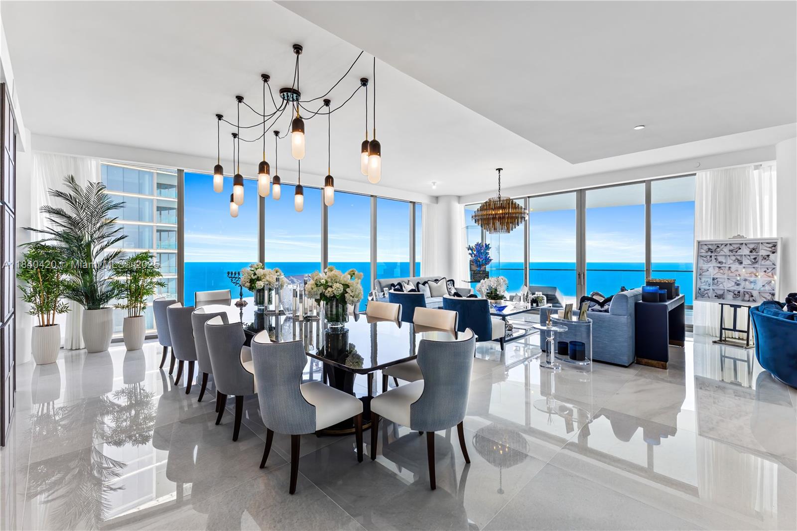 Experience unparalleled luxury in this one-of-a-kind Tower Suite at Miami’s most prestigious address, The Estates at Acqualina. Designed by the internationally acclaimed Argent Design of London, this sprawling residence offers nearly 10,000 square feet of meticulously crafted indoor and outdoor living space. Step into a world of elegance with custom millwork, exquisite marble and onyx finishes, a chef’s kitchen, and cutting-edge Control4 smart home technology. Perfect for both family living and entertaining. Enjoy over 1,600 square feet of outdoor living complete with a jetted lap pool, plunge pool, outdoor sauna, and a summer kitchen – all set against the backdrop of the Atlantic Ocean.