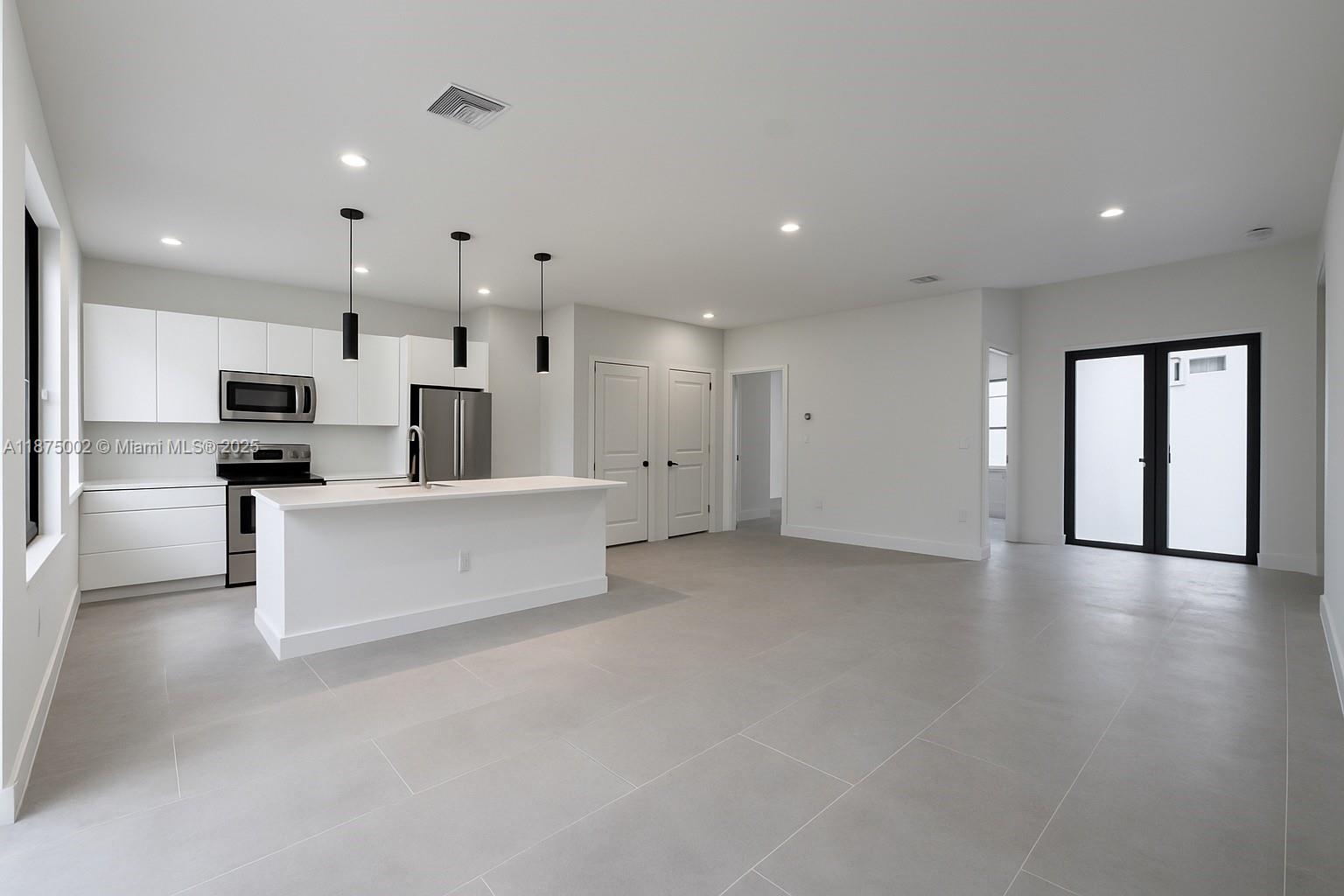 Brand new construction home, ready to move in! This modern residence features 3 spacious bedrooms, 2 full bathrooms, plus a versatile den that can be used as a home office, playroom, or guest space.
The open concept floor plan offers a bright and spacious living area with high ceilings, sleek porcelain tile floors throughout, and large windows that fill the home with natural light. The kitchen boasts a contemporary design with a central island, quartz countertops, modern cabinetry, and stainless steel appliance setup.Additional features include impact windows and doors, laundry area, and a large backyard with plenty of space to add a pool or create your dream outdoor living space, this property offers comfort, style, and functionality the perfect opportunity to own a brand-new home!
