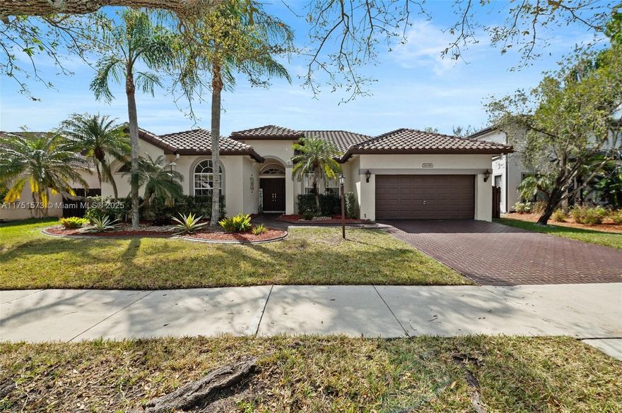 This 5 bedroom 2.5 bath single-story Princeton IV Model executive home is located in the prominent gated-community of Stoneridge Lake Estates. The airy home model design is perfect for active family living, entertaining and enjoyment. The split floor-plan includes formal living and dining, complimented by an accommodating family room and oversized man cave. To further enhance your tropical lifestyle living experience, a 525+ sf covered and screened-in lanai allows for endless days of outdoor living and relaxation, and provides a seamless flow of interior/exterior living area. Located near top-rated public schools, this home offers the perfect blend of privacy, comfort, and functionality, making it ideal for the discerning buyer. The roof was replaced in 2018.