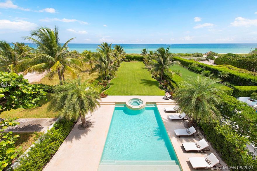 Start the day w/ a sunrise walk along the beach from private, guard-gated Altos Del Mar villa DIRECLTY ON THE OCEAN at highest flood elevations in Miami Beach. Turnkey opportunity with brand new furnishings & a Raymond Jungles-designed landscaped garden & rooftop terrace. 1st floor cabana kitchen & family room (plus two bedrooms) opens to covered loggia w/ summer kitchen & bar. Enjoy privacy in the infinity pool while guests lounge on grassy areas or walk a few steps to the beach. Enjoy views from 2nd floor master w/ private terrace, his/her master bath toilet rooms/sinks & three additional bedroom suites. Stunning vistas from 3rd floor kitchen, living, dining, & family rooms and seaside dining terrace. Two detached 2nd floor guest suites in 3 car carriage house for 7 parking spaces total.