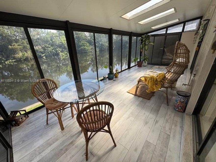 **PLEASE READ BROKER'S REMARKS** FULLY FUNISHED - PRIME WATERFRONT LOCATION has SERENE VIEW OF LAKE & TREES w/ the GOLF COURSE just beyond! First floor bedroom w/ closet has been opened for use as a den - easily converted back. Eat in kitchen has additional with bar area. Master bedroom upstairs has a sitting room & a PRIVATE BALCONY to enjoy the PEACEFUL WATER VIEWS! Large 2nd bedroom has it's own private bath. Screened patio w/ sliding panels. NEWER ROOF & FRESHLY PAINTED exterior. Partial ACCORDION HURRICANE SHUTTERS. Two assigned parking spaces in front. Just needs TLC to MAKE IT HOME! Clubhouse includes pool, gym, sauna, rec room w/ pool table, darts, foosball and cable TV/Wi-Fi.