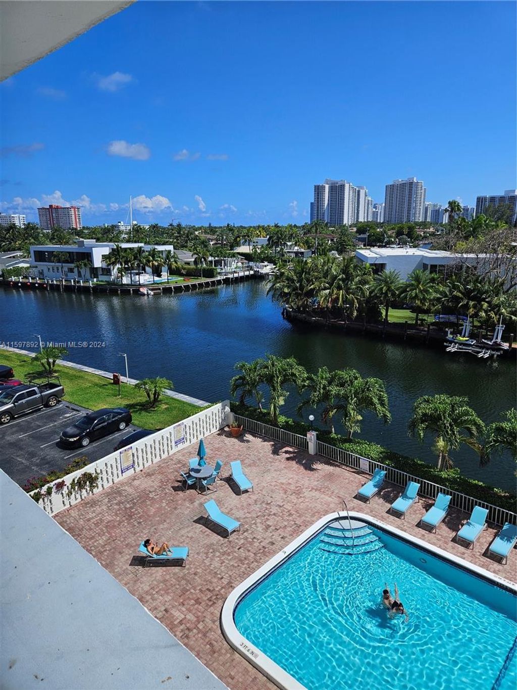 Photo of 401 Golden Isles Dr #303, Hallandale Beach, FL 33009 (MLS # A11597892)