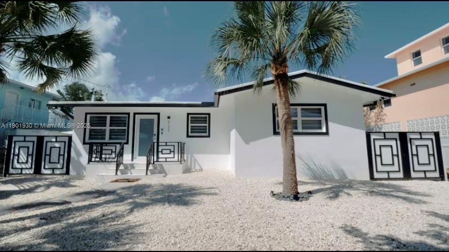 Your Florida Keys Oasis is Here! Welcome to your slice of paradise, where turquoise waters, warm breezes, and endless sunshine create the lifestyle you've always dreamed of. This home offers all the amenities and easy ocean access you need to fully embrace the Florida Keys way of life,  on one of the only Gulf Side flow through canals in the Middle Keys. CBS construction on 60 feet of waterfront property with 40 feet of composite dockage and 14K lb boatlift. Enjoy immediate, direct access to the Gulf of Mexico, just minutes to Sombrero Beach, Marathon Jet Center, restaurants, shopping, and world-class diving and fishing. This property is not just a dream home it's a fantastic vacation rental with 7-day minimums and current rentals in place. Don't miss this prime investment opportunity!