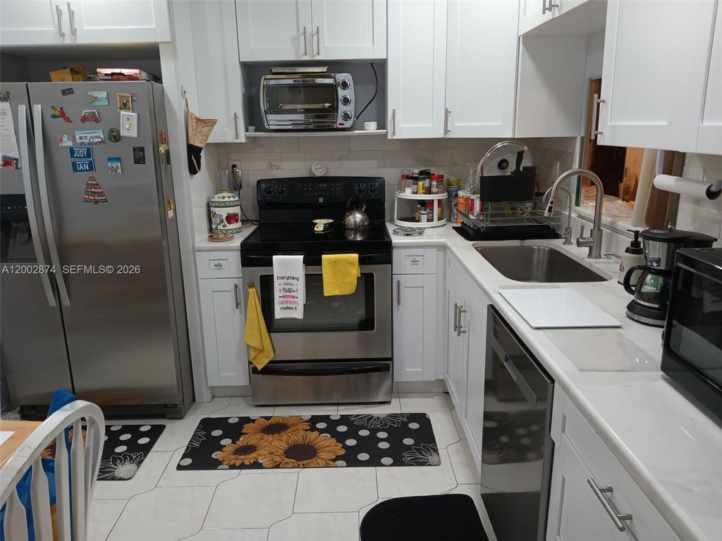 Photo of 6301 N University Dr #202, Tamarac, FL 33321 (MLS # A12002874)