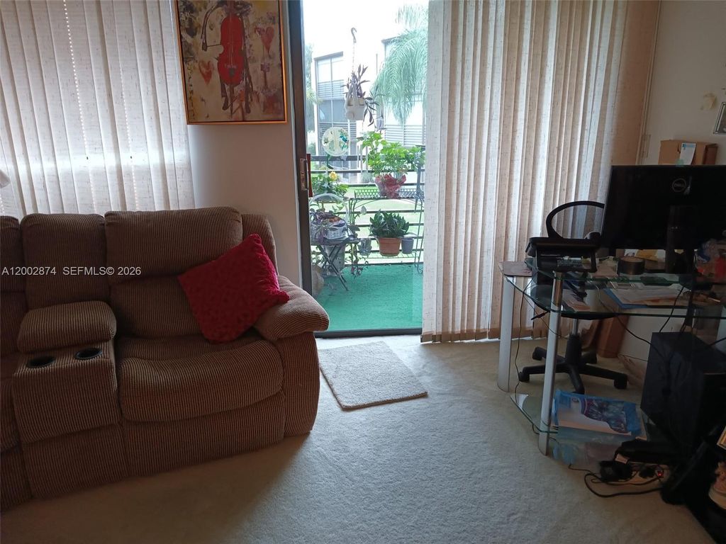 Photo of 6301 N University Dr #202, Tamarac, FL 33321 (MLS # A12002874)