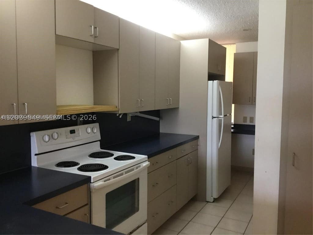 Photo of 6800 Cypress Rd #411, Plantation, FL 33317 (MLS # A12039549)