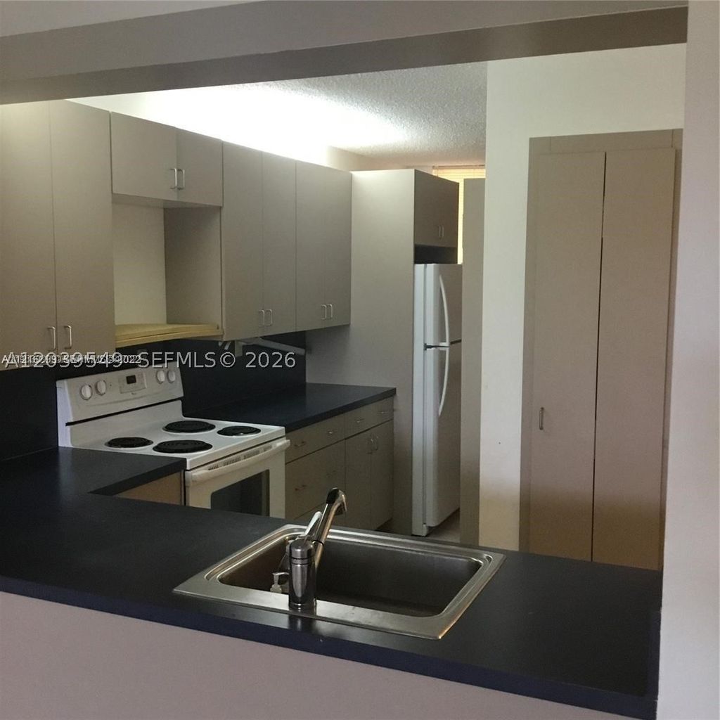 Photo of 6800 Cypress Rd #411, Plantation, FL 33317 (MLS # A12039549)