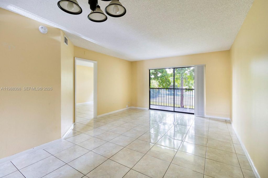Photo of 9044 NW 28th Dr #3-302, Coral Springs, FL 33065 (MLS # A11988308)