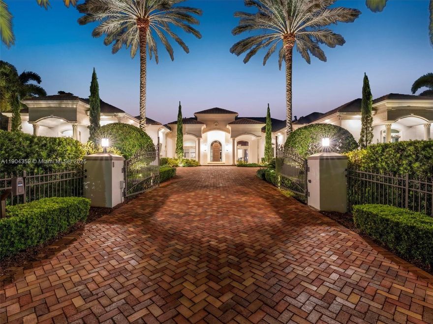 Behind a lush wall of Areca Palms, this 7-bedroom, 8.5-bath estate on 1.22 acres offers the rare blend of privacy, luxury, and space. With 6,842 sq ft under soaring 14-ft ceilings, every detail is built for elevated living. The chef’s kitchen features Sub-Zero refrigeration, Wolf appliances, and custom storage. A Control4 smart system, projector-equipped media room, and en-suite baths in every bedroom ensure effortless comfort. The primary suite boasts dual “hers” closets and a spa bath with two private toilet rooms and Toto Washlets. Outdoors, enjoy a heated pool and spa, koi pond, summer kitchen, guest house, and whole-home generator — all behind a gated entry. It's time to experience the pinnacle of Plantation Acres Living
