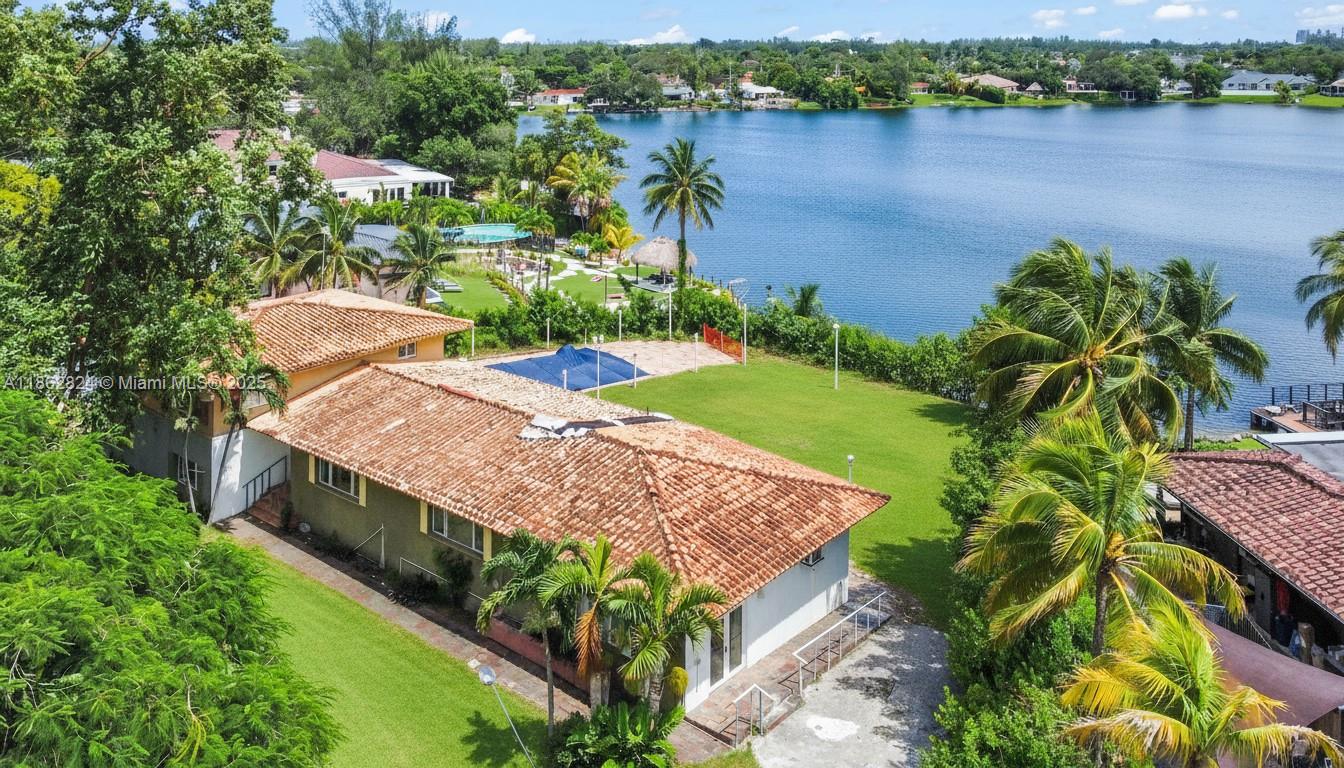 Spacious two-story estate located in one of Miami’s most desirable neighborhoods. This gated residence sits on a generous lot with a private driveway and offers stunning lake views. The home features an inviting layout with ample living space, perfect for both relaxation and entertaining. Ideally situated near Tropical Park, top-rated schools, shopping, and dining, with easy access to South Miami and Coral Gables. A rare opportunity to own a private lakefront property in a prime location. The seller does not accept blind offers or escalation clauses.
