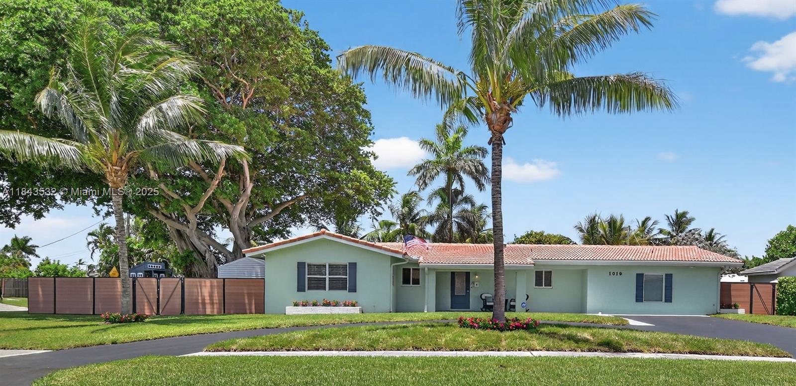 Discover this beautifully updated 3 bedroom, 3 bath home on a spacious ¼-acre lot in a charming beach town—just 1 mile from the ocean! Featuring two primary suites, a flexible den/office (possible 4th bedroom), and a chef’s custom kitchen, this home blends luxury and comfort with everyday practicality. Enjoy peace of mind with hurricane impact-rated windows and doors, a circular driveway, and a thoughtfully designed layout perfect for all. The oversized backyard is your private paradise—complete with a large swimming pool, a playground with a slide and turf, a whimsical tree swing, and a 10x12 hurricane-rated shed for storage or workspace. The entire yard is enclosed with a high-end composite hurricane-rated fence for ultimate privacy and durability.