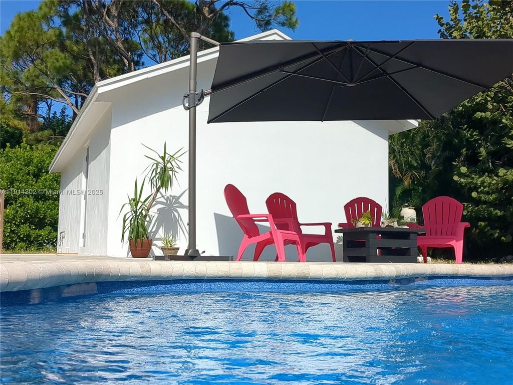 Photo of 11324 Palm Tree Ln, Palm Beach Gardens, FL 33410 (MLS # A11914302)