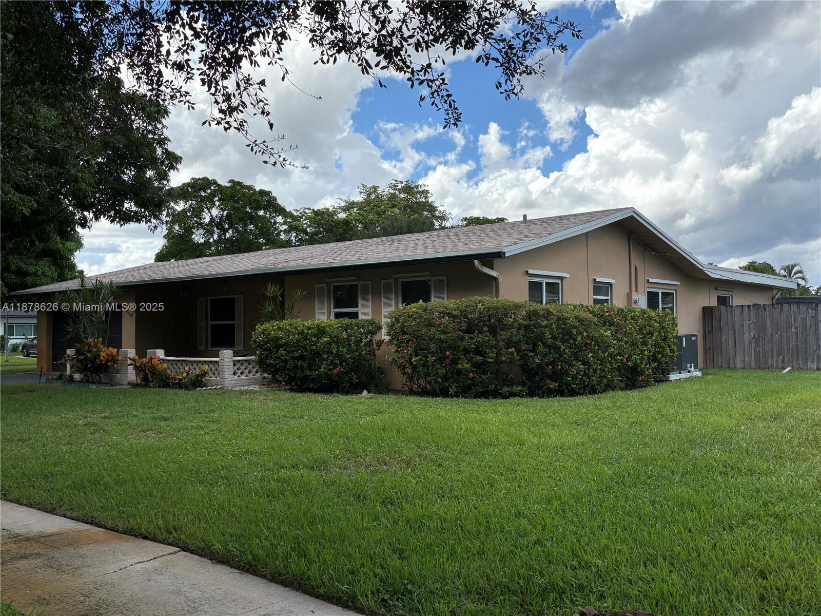 Look no further! The family home you have been looking for is this one. Sitting on an oversized corner lot, this home features 3 bedrooms and 2 bath with over 1800 sqft of living area. Feel secure knowing the property has a new roof (2024), new AC (2025), and hurricane impact windows and doors all throughout the home. If your looking for space; you got it here with over 10K sqft of property and a backyard that includes a pool. Enjoy entertaining with a large backyard that can store an RV or boat if needed. Fruit trees all around the property give you seasons of fresh fruit. Including a Lychee tree in your front yard. Come view this property as it will be highly sought out.