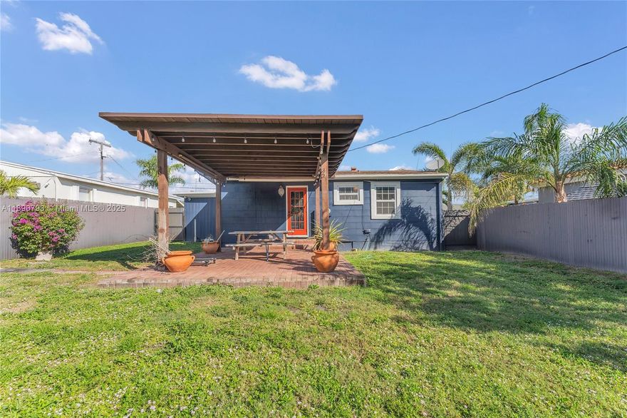Just 3 miles from the beach! Charming 2-bed, 1-bath home offering privacy, comfort, and convenience. Features a newer gate and fence, spacious backyard with a kumquat/tart orange tree, perfect for entertaining or relaxing outdoors. Prime location near shopping, I-95, the zoo, PBI Airport, and downtown. Recent updates include a fully renovated kitchen (2021), new interior/exterior paint, flooring, doors, remodeled bathroom, shed, and front gate. A/C (approx. 6 yrs) and water heater (5 yrs) well well maintained. Home feels larger than the stated square footage, with room to add a pool.