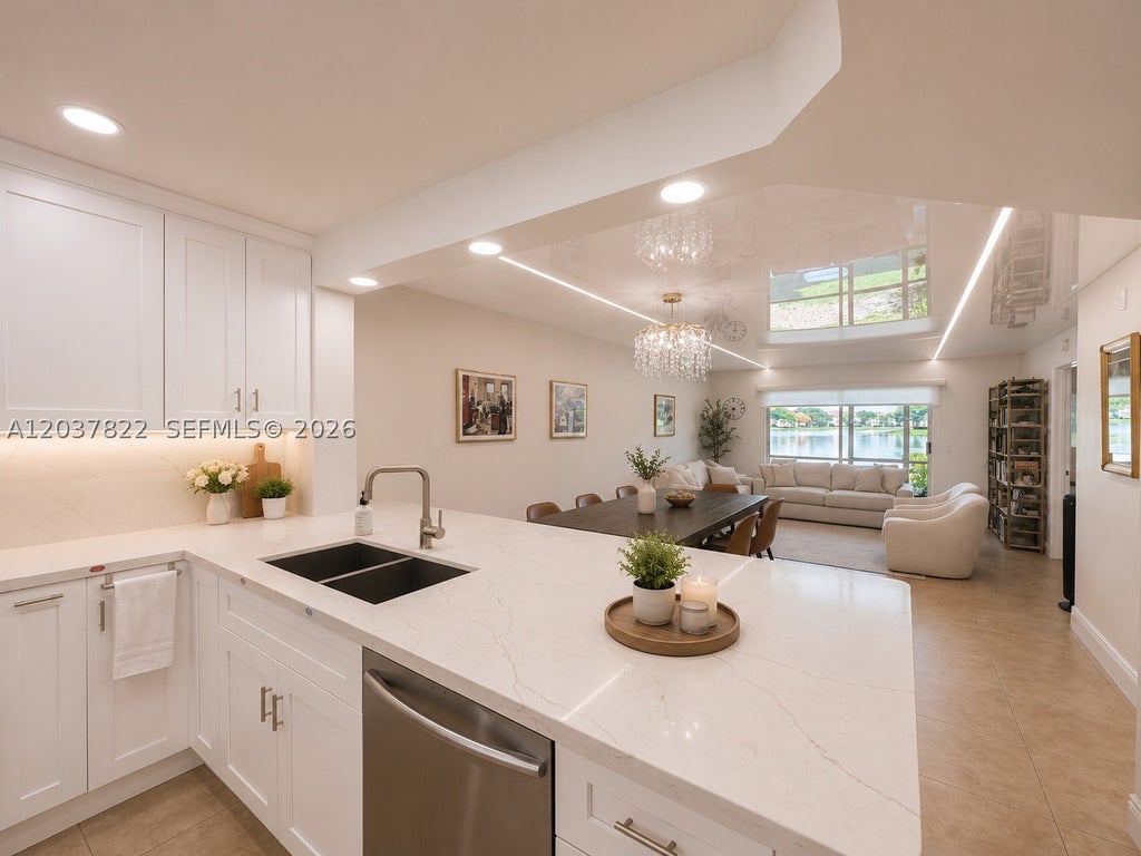 Photo of 13701 SW 12th St #103A, Pembroke Pines, FL 33027 (MLS # A12037822)