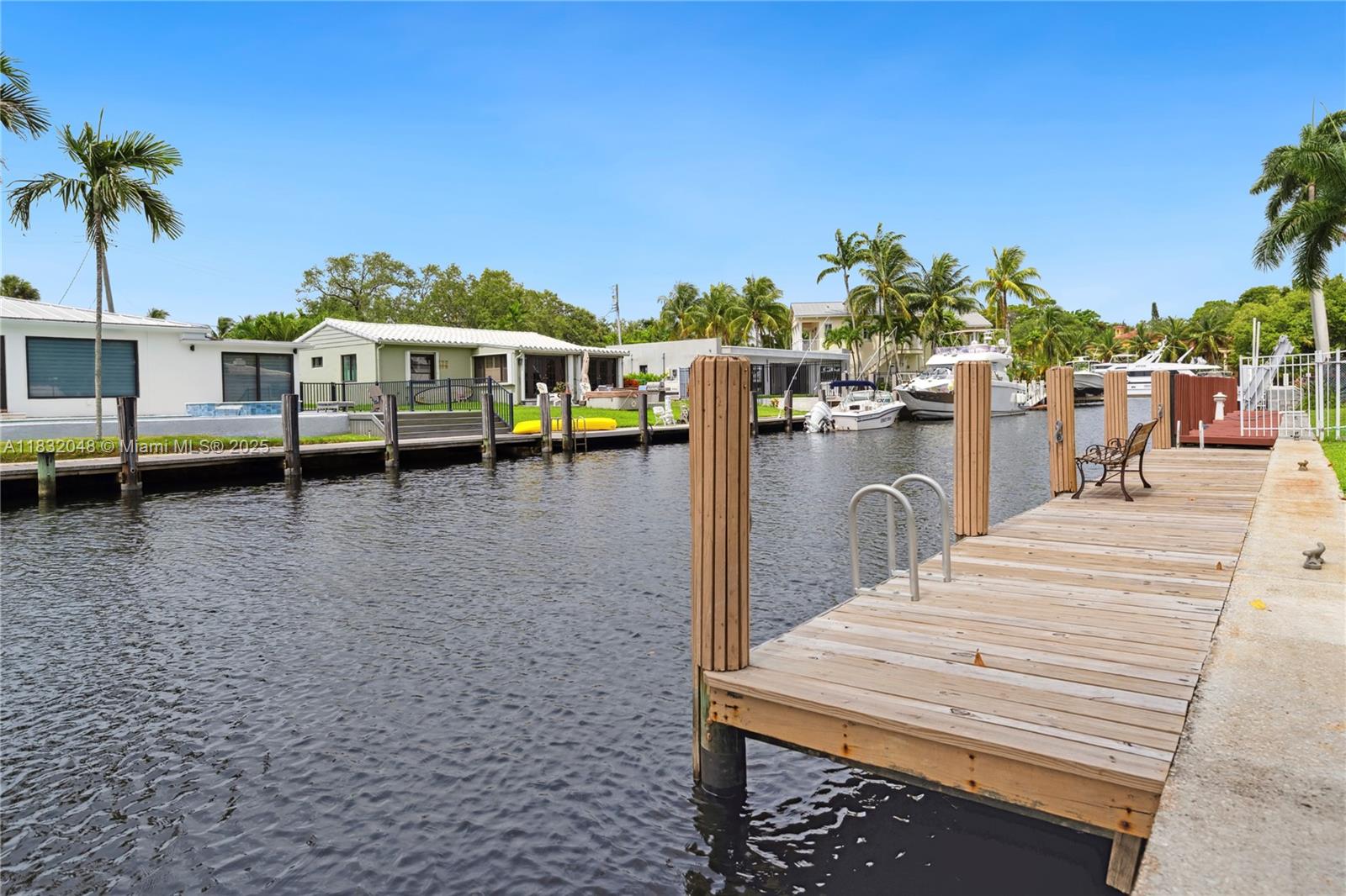For the first time ever available to the public, 1328 Mango Isle is one of the original homes built on the Isles, owned by the same family since 1953. This waterfront property offers strong fundamentals with numerous functional upgrades: impact windows and doors, updated electric and plumbing, new tile roof, tankless water heater, AC, closed-in carport, and a dock with water and electric (boards replaced in 2023). Also features a new deck with pergola, sprinkler system, and full fencing. Can easily be converted to a 3 bed/2 bath. Located just minutes from Las Olas, the beach, and downtown Fort Lauderdale — an unbeatable location with history, land, and long-term potential.