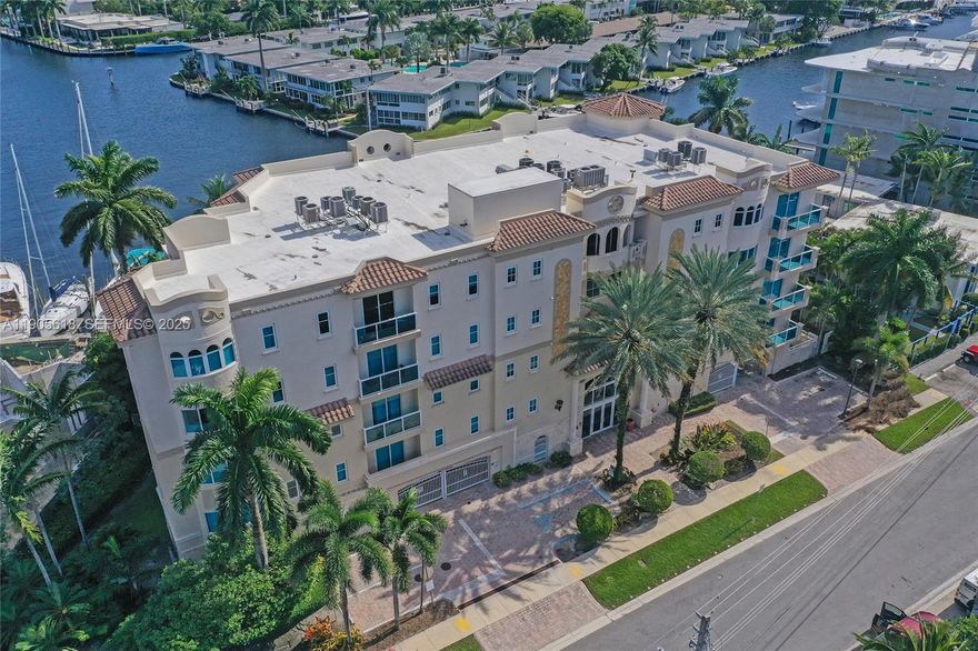 Exceptional corner condo at Hendricks Isle off the vibrant Las Olas. Waterfront elegance in this impressive 2-bedroom, 2 bath residence spanning 2400 square feet with BOAT SLIP and LIFT. Panoramic water vistas throughout this meticulously maintained condo. Features a grand double-door entrance. Open kitchen boasts all stainless appliances, granite tops and large island w/ built-in wine cooler. Primary and guest bedrooms offer large walk-in closets and spacious en-suites. Additional highlights include formal dining space, laundry room, whole-home water filtration, tankless water heater, two assigned parking spots, plus storage. Building amenities feature a resort-style pool, grilling stations, and modern fitness facility. LOW HOA. Seller is motivated and has moved! VIDEO TOUR IN THE LINK.