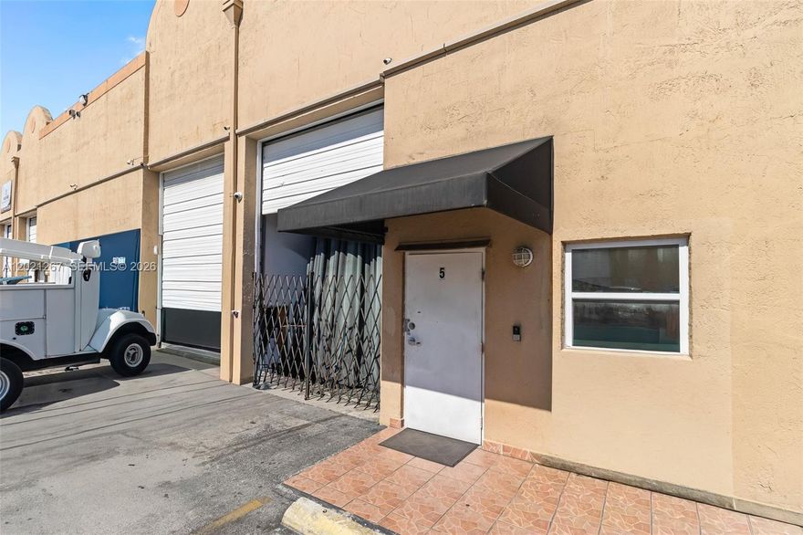 Rare opportunity to own a highly built-out industrial condo in Hialeah's thriving commercial corridor. This 1,160 SF unit features a welcoming reception area, multiple private offices, a fully equipped kitchenette with wood cabinetry and granite countertops, two full bathrooms with showers, and security gating throughout — truly move-in ready for a wide range of business operations.
The warehouse bay boasts soaring 20-foot ceilings, pallet racking in place, and an oversized overhead drive-in door — ideal for storage, distribution, light manufacturing, and trades. The quality of the build-out eliminates the need for costly tenant improvements.
Minutes from the Palmetto Expressway on-ramp and Okeechobee Road, with seamless access to all of Miami-Dade and Broward. Directly across from Lowe's and Target.
Low monthly HOA covers building structure and roof. Ideal for contractors, logistics operators, small business owners, or 1031 exchange buyers.
Exceptional value in a tight industrial market — schedule your showing today.
