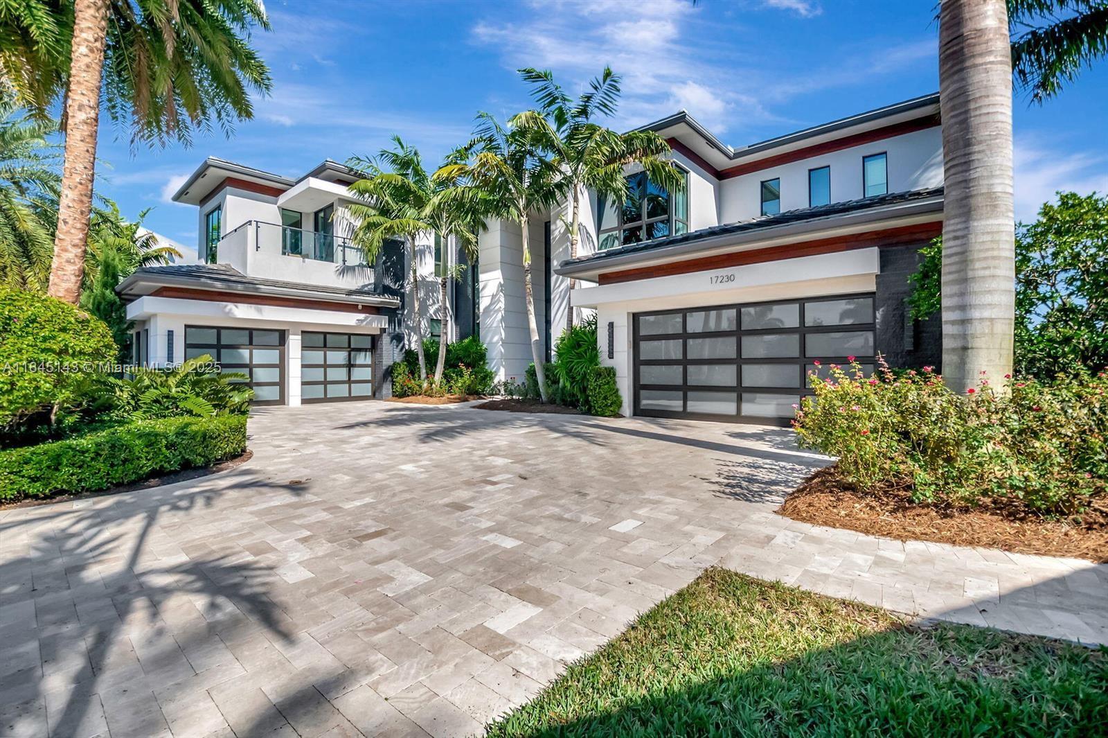 Ultra luxury rental in exclusive Boca Bridges community which offers a unique upscale lifestyle. Grand lakefront residence features 6 bedrooms, 8.1 bathrooms and a 4-car garage. Its contemporary design is accentuated by striking glass walls & a stylish stair rail. Inside, you'll find a designer kitchen, a wine closet, & a cozy fireplace. The dual master suite upstairs boasts a wrap-around balcony, while additional spaces include a game room, office, loft, & club room. This home is equipped with an elevator, charging station, generator & impact windows for added convenience and safety. The outdoor pool area is ideal for entertaining family and friends, complete with breathtaking views, a summer kitchen, & a relaxing spa.