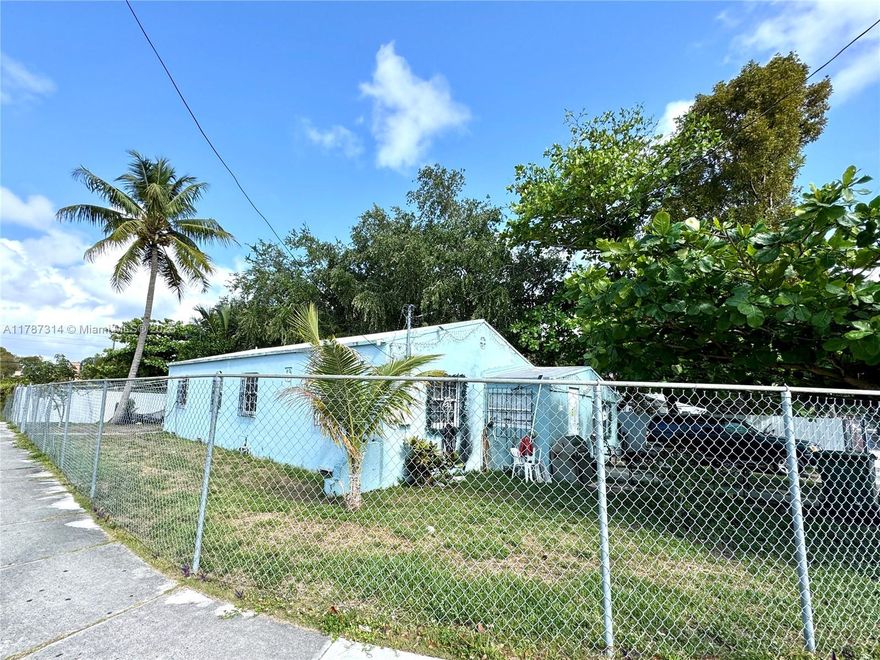 Large corner 4 bedroom, 3 bedroom single family, porcelain floors, all fenced, tenant pays 1,800 and is willing to stay. Perfect for investor. Located in Little Haiti, east of 95, on charming NW 1st place that hosts the 3 acre Miami Tropical Botanic garden