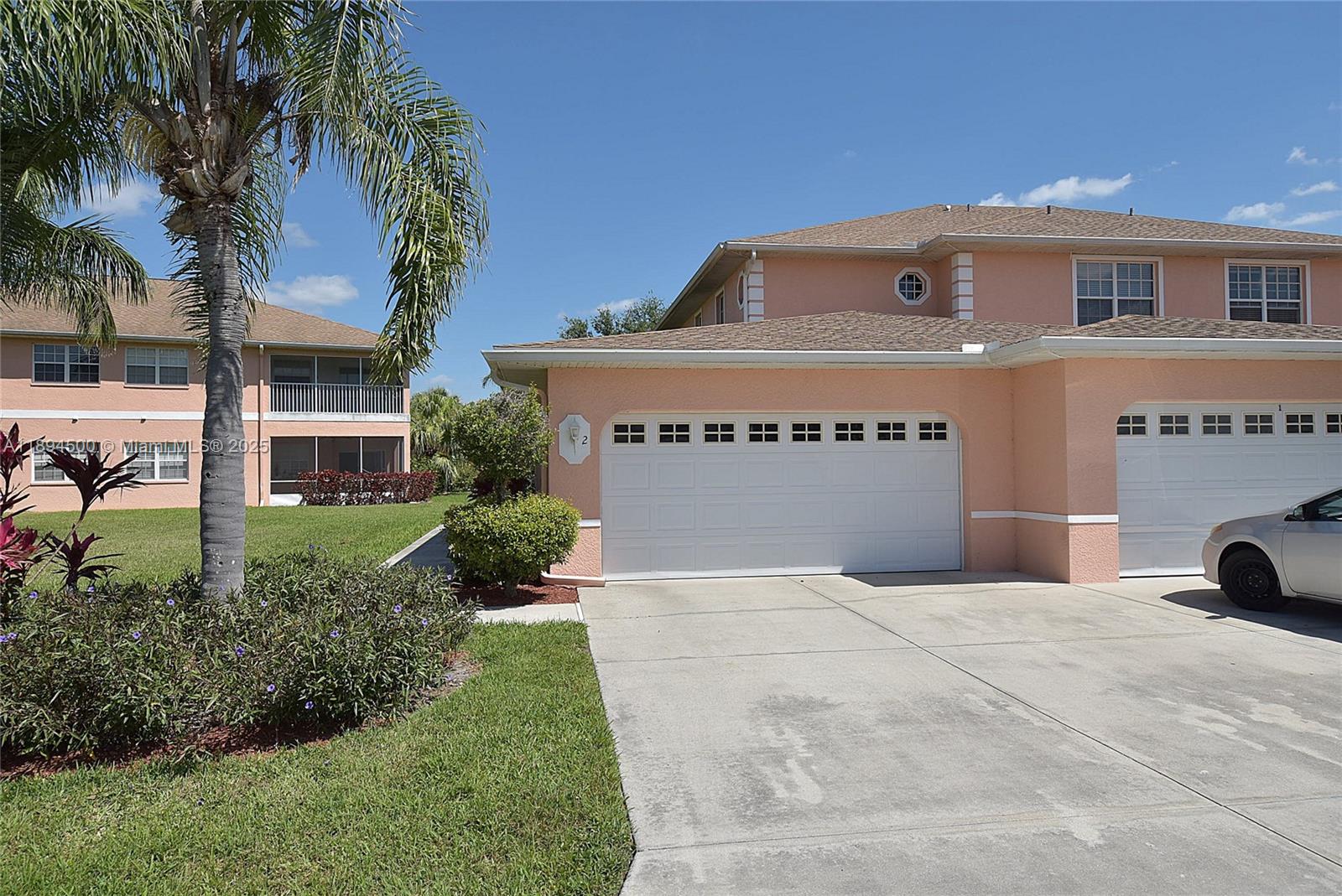 Spacious, second floor 3 bedrooms and two bathrooms wit a 2 car garage unit. Well kept unit with separated living area and dining area. Eat- in kitchen counter and plenty of wall cabinet storage. The guest bathroom has an additional laundry area. Two of the bedrooms are towards the front and the primary bedroom towards the rear of the property. Carpet flooring on the bedrooms, stairs and living room areas. Tile flooring at the kitchen, dining and bathrooms areas. There is a laundry area with a wash tub at the garage too. Screened balcony with exterior ceiling fan and lights. Beautiful place surrounded of well landscaped areas. Located near businesses, and SR82 road.
